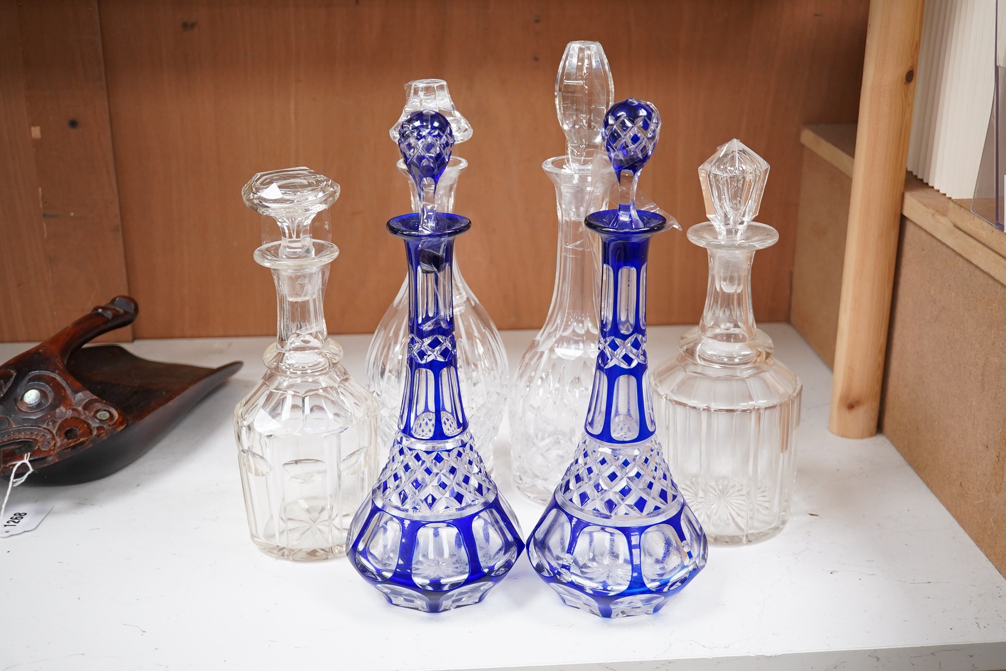 A near pair of blue flashed decanters and stoppers and four other decanters and stoppers, tallest blue flash decanter and stopper, 34cm high (6). Condition - fair to good